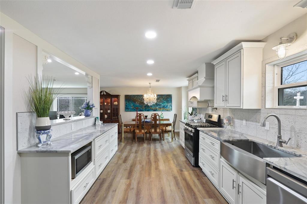 110 Vanshire Road West Lakeside, TX 76108 - Photo 6 of 34 a large kitchen with stainless steel appliances a lot of counter space and a sink