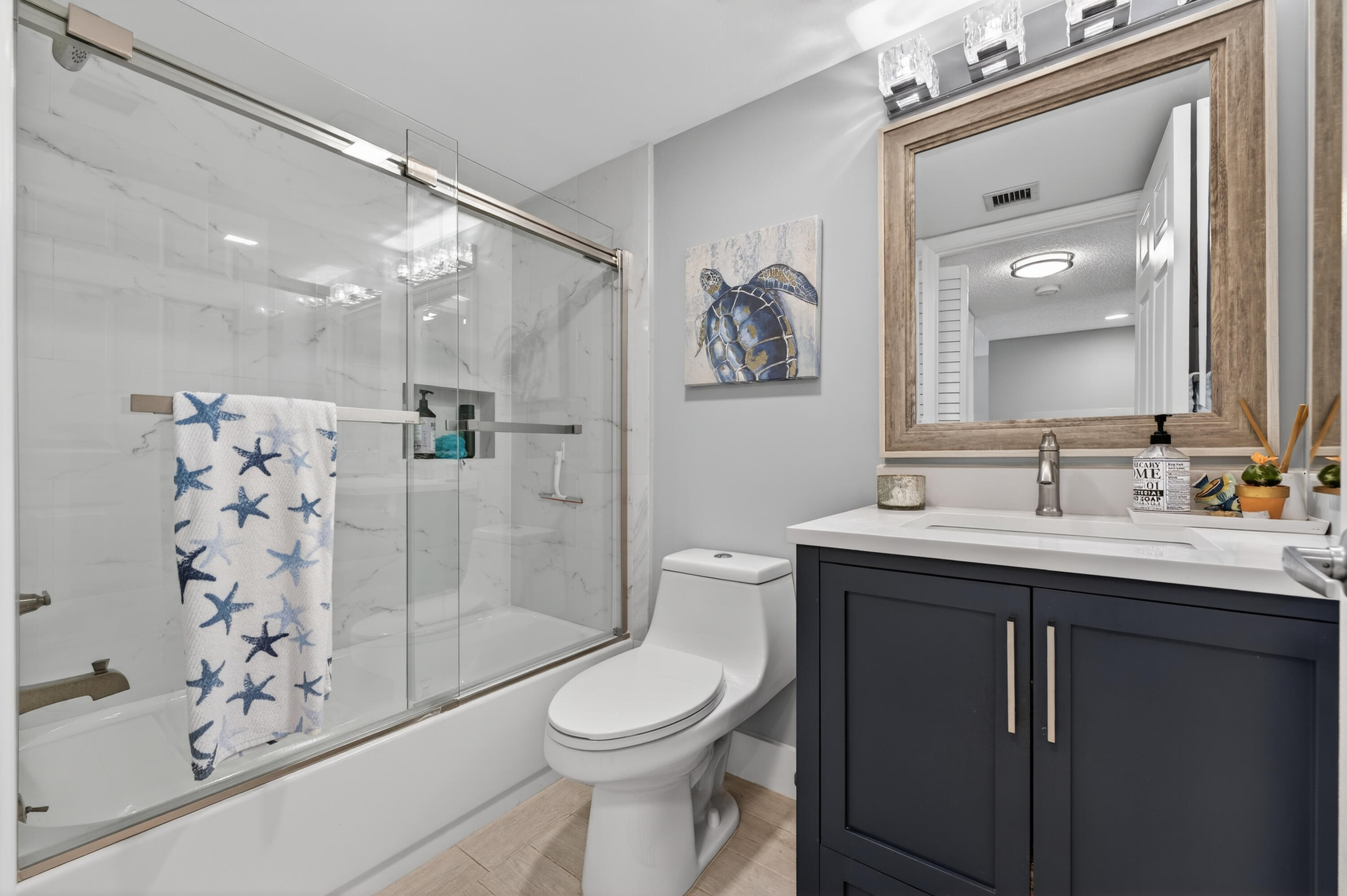 7142 South Devon Drive, Unit 210 Tamarac, FL 33321 - Photo 17 of 36 a bathroom with a sink toilet and shower