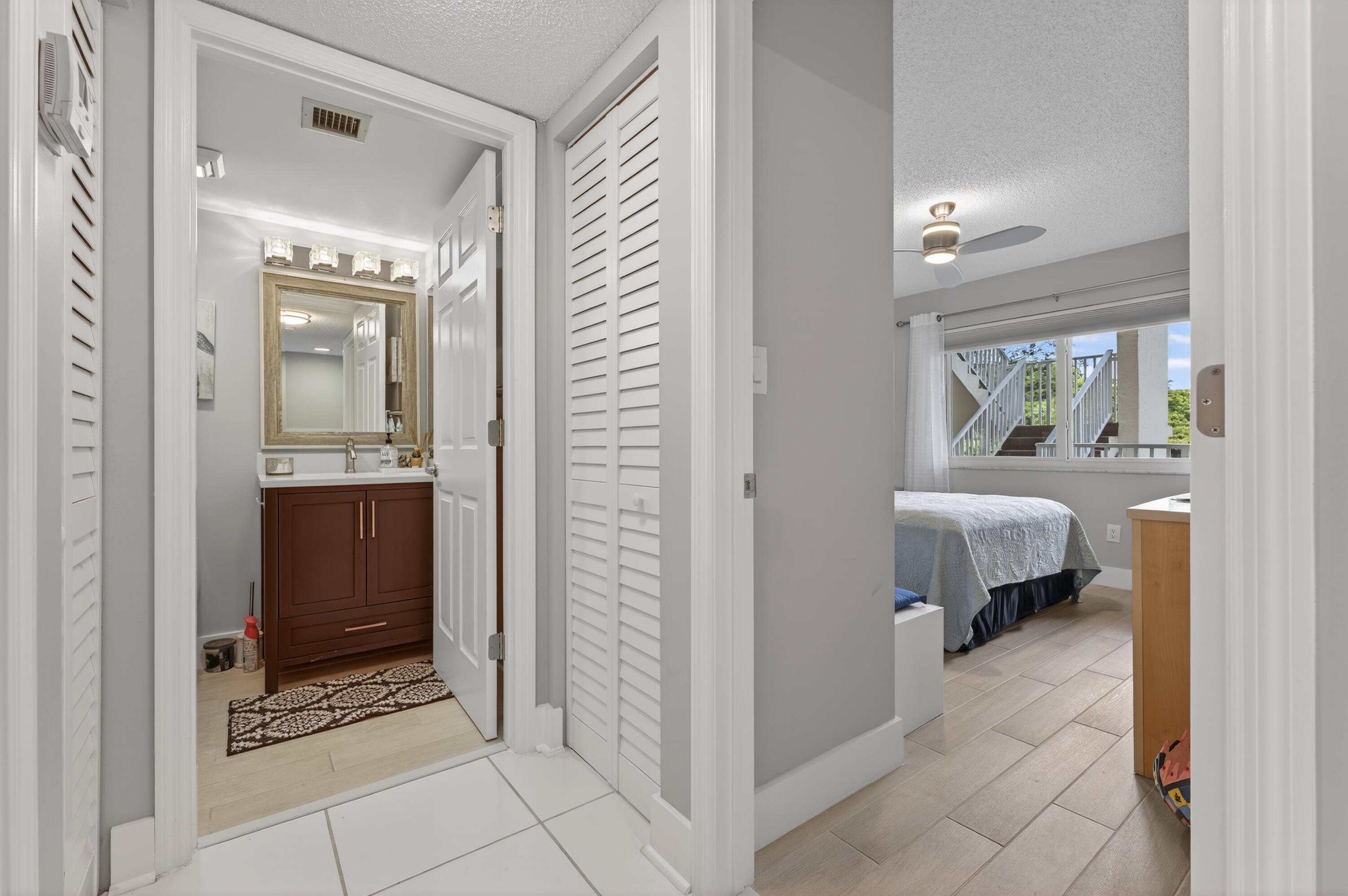 7142 South Devon Drive, Unit 210 Tamarac, FL 33321 - Photo 18 of 36 a bathroom with a glass door shower and a sink