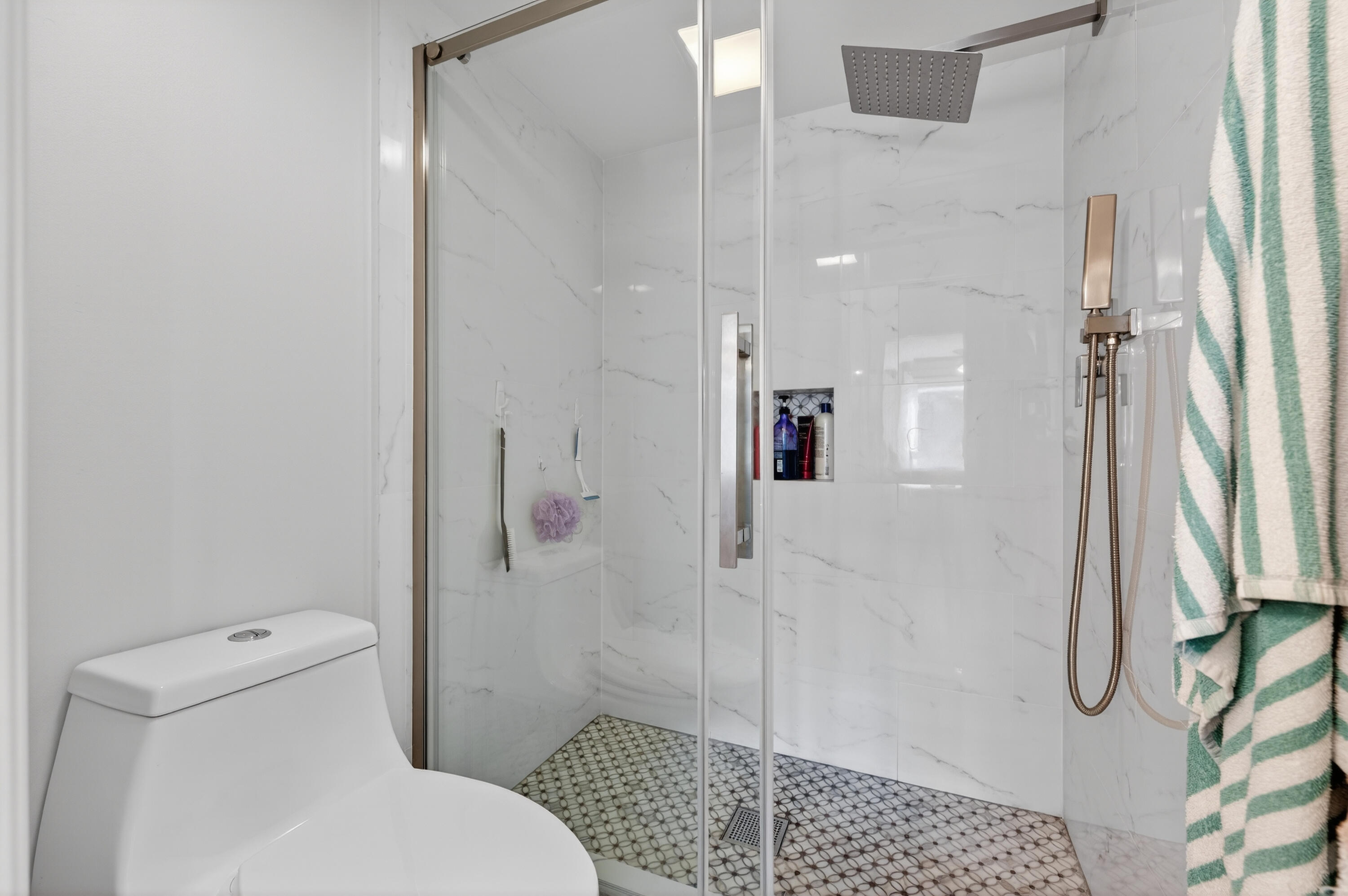 7142 South Devon Drive, Unit 210 Tamarac, FL 33321 - Photo 26 of 36 a bathroom with a shower and a toilet