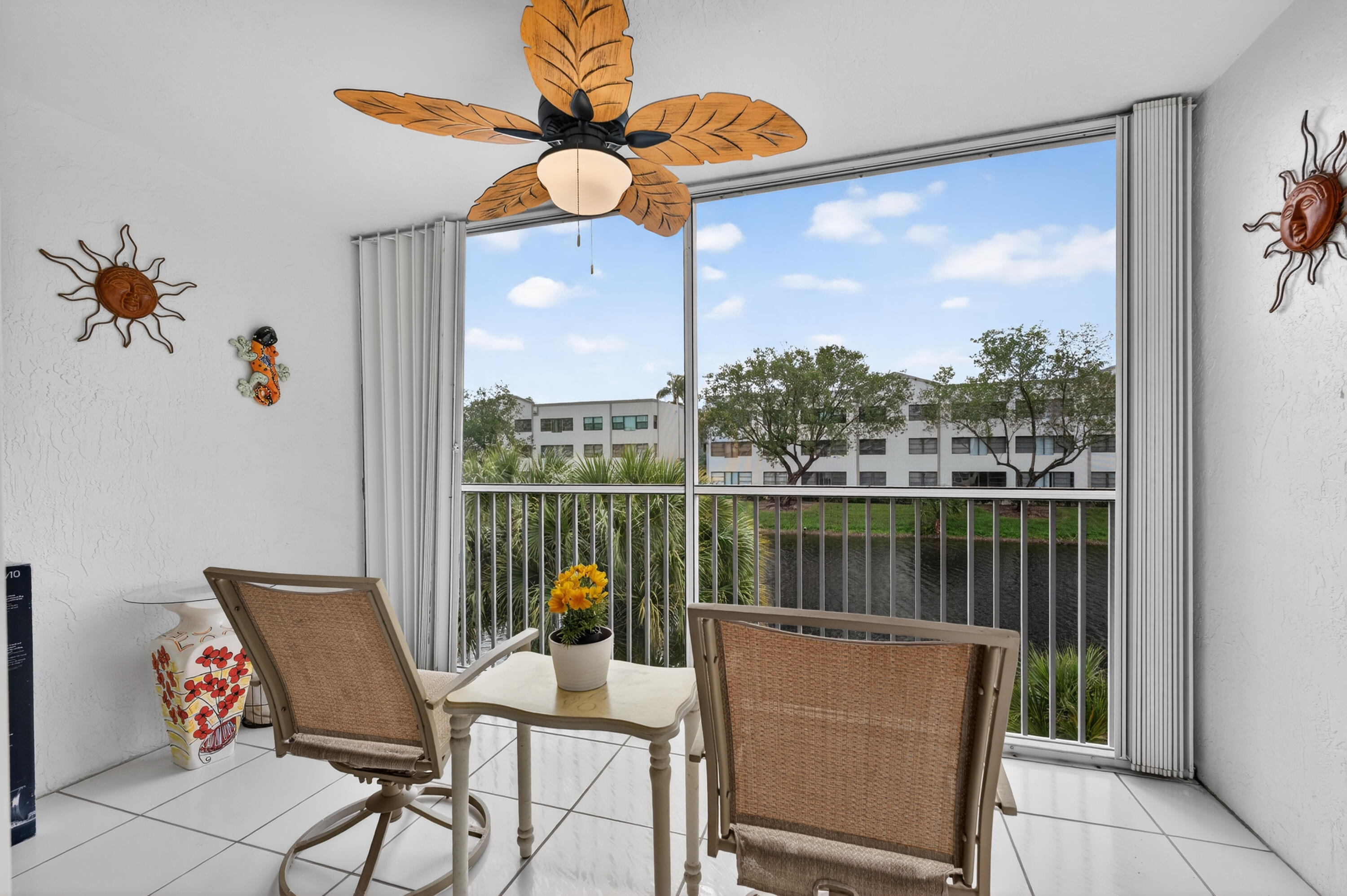 7142 South Devon Drive, Unit 210 Tamarac, FL 33321 - Photo 30 of 36 a view of a chairs and table in patio of the house