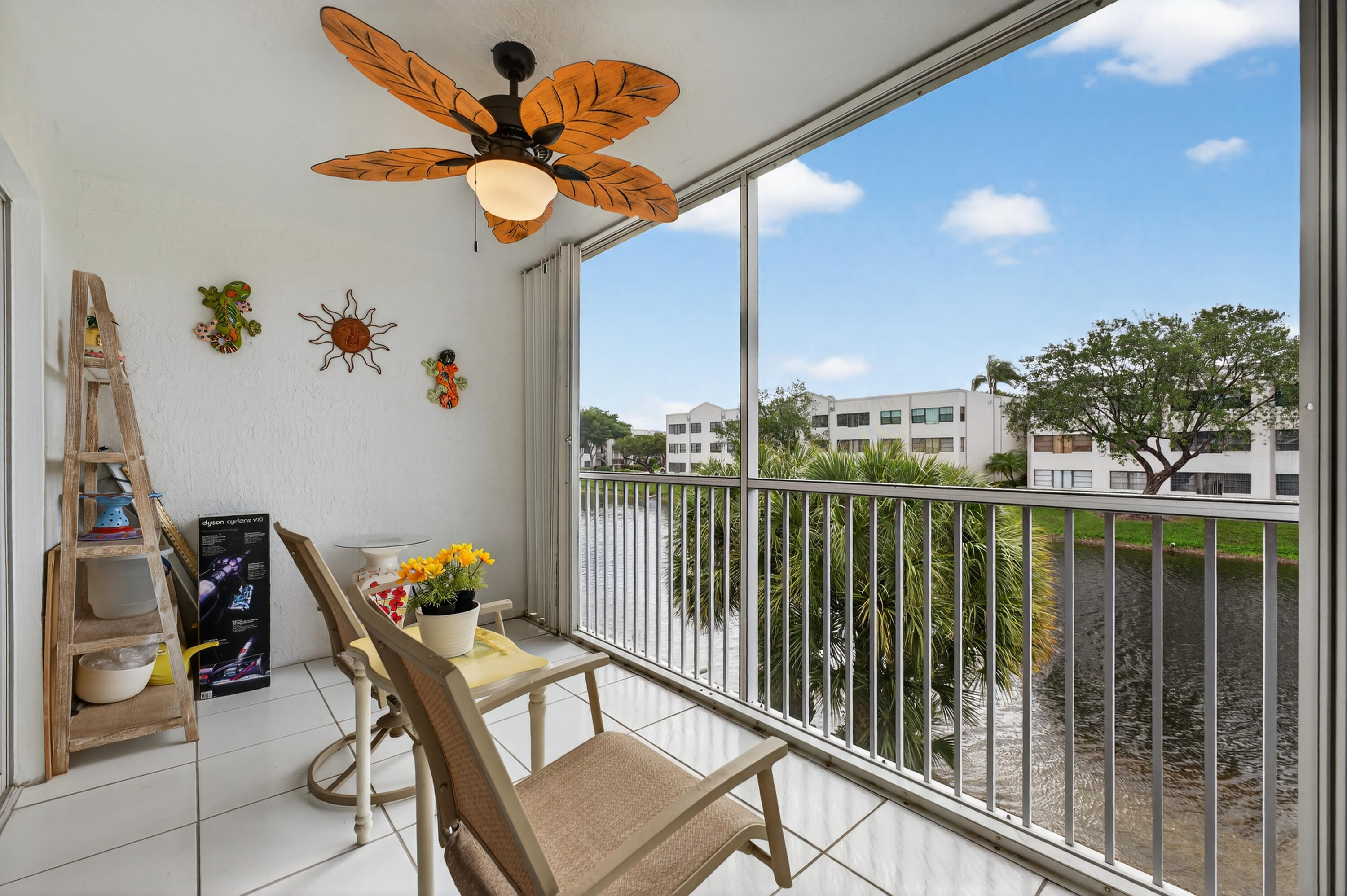 7142 South Devon Drive, Unit 210 Tamarac, FL 33321 - Photo 31 of 36 a view of a balcony with chairs