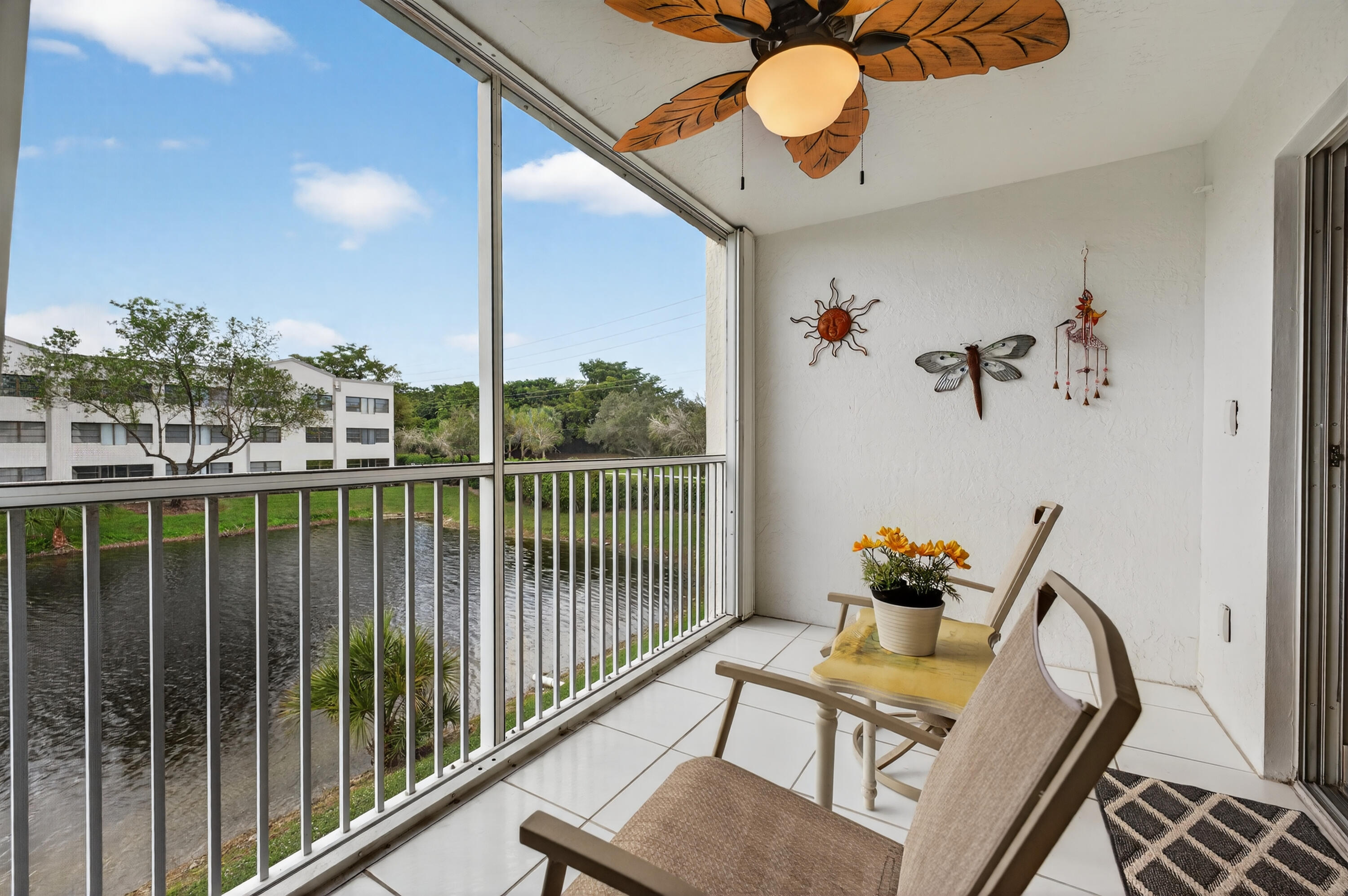 7142 South Devon Drive, Unit 210 Tamarac, FL 33321 - Photo 32 of 36 a view of a balcony furniture