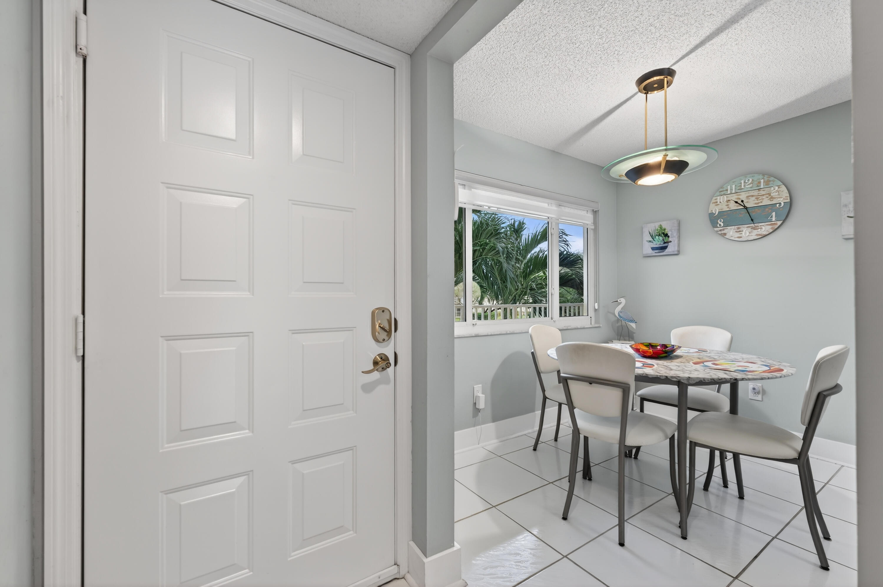 7142 South Devon Drive, Unit 210 Tamarac, FL 33321 - Photo 4 of 36 a view of a dining room with furniture window and outside view