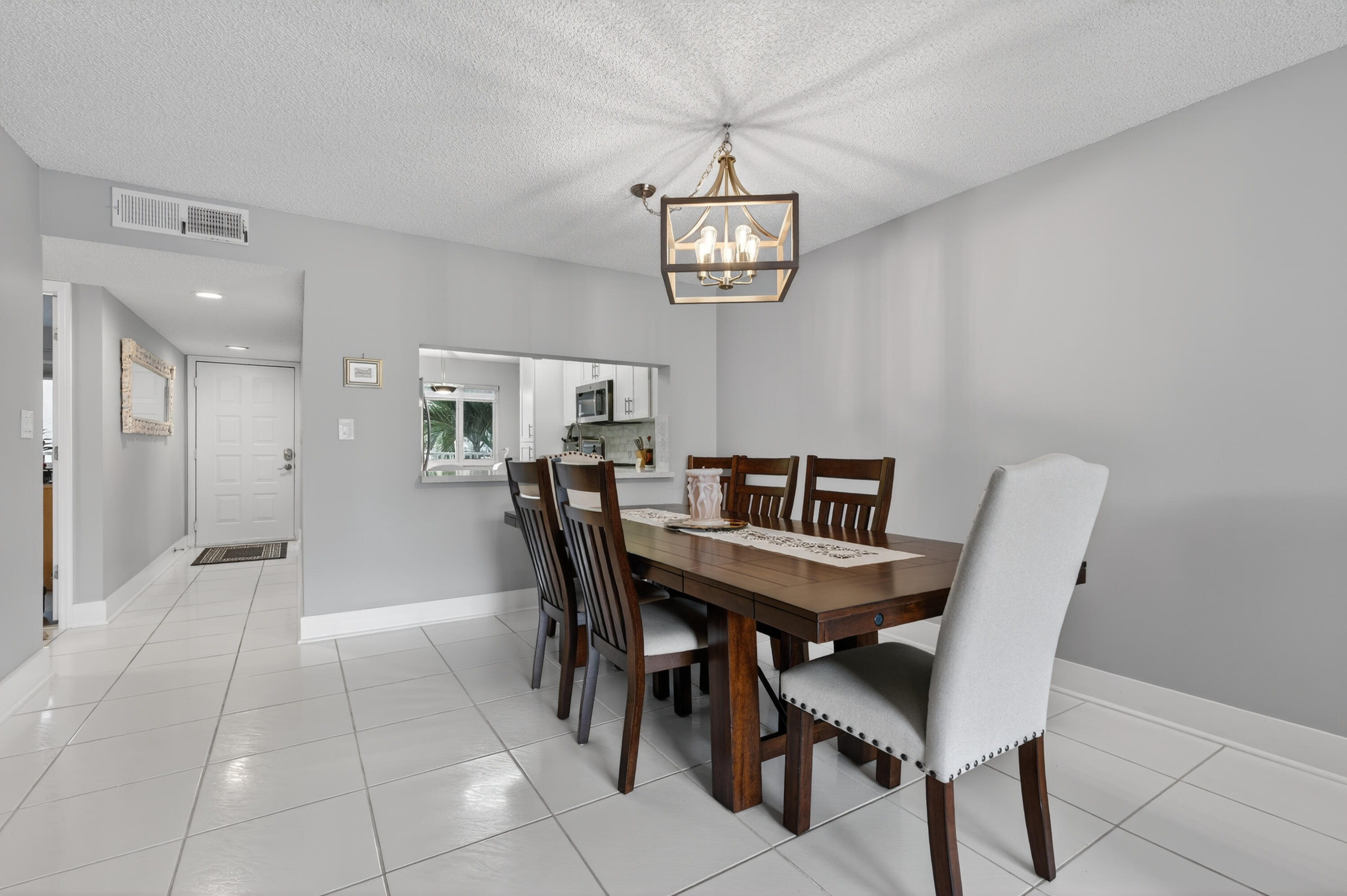 7142 South Devon Drive, Unit 210 Tamarac, FL 33321 - Photo 10 of 36 a view of a dining room with furniture
