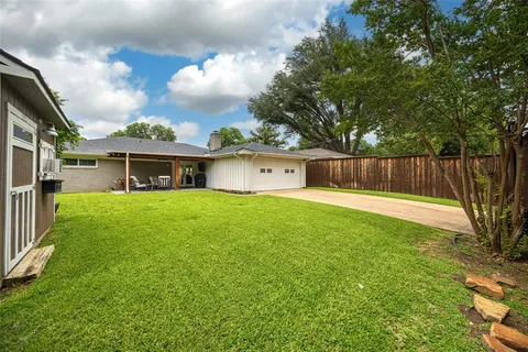 a front view of house with yard and entertaining space