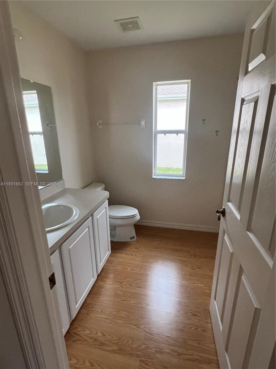 1679 Southwest 156th Lane Ocala, FL 34473 - Photo 12 of 16 a bathroom with a sink a washer and dryer