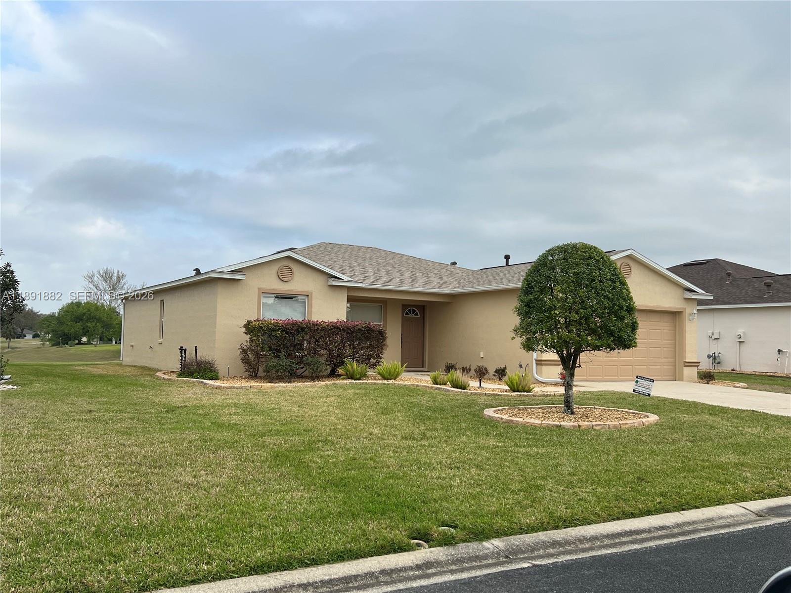 1679 Southwest 156th Lane Ocala, FL 34473 - Photo 2 of 16 a house view with swimming pool and garden