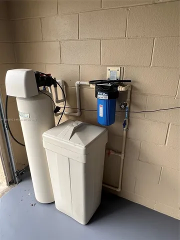 a view of storage and utility room with washer and dryer