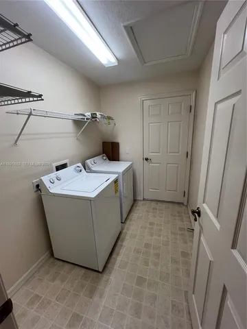 a room with a sink and cabinets