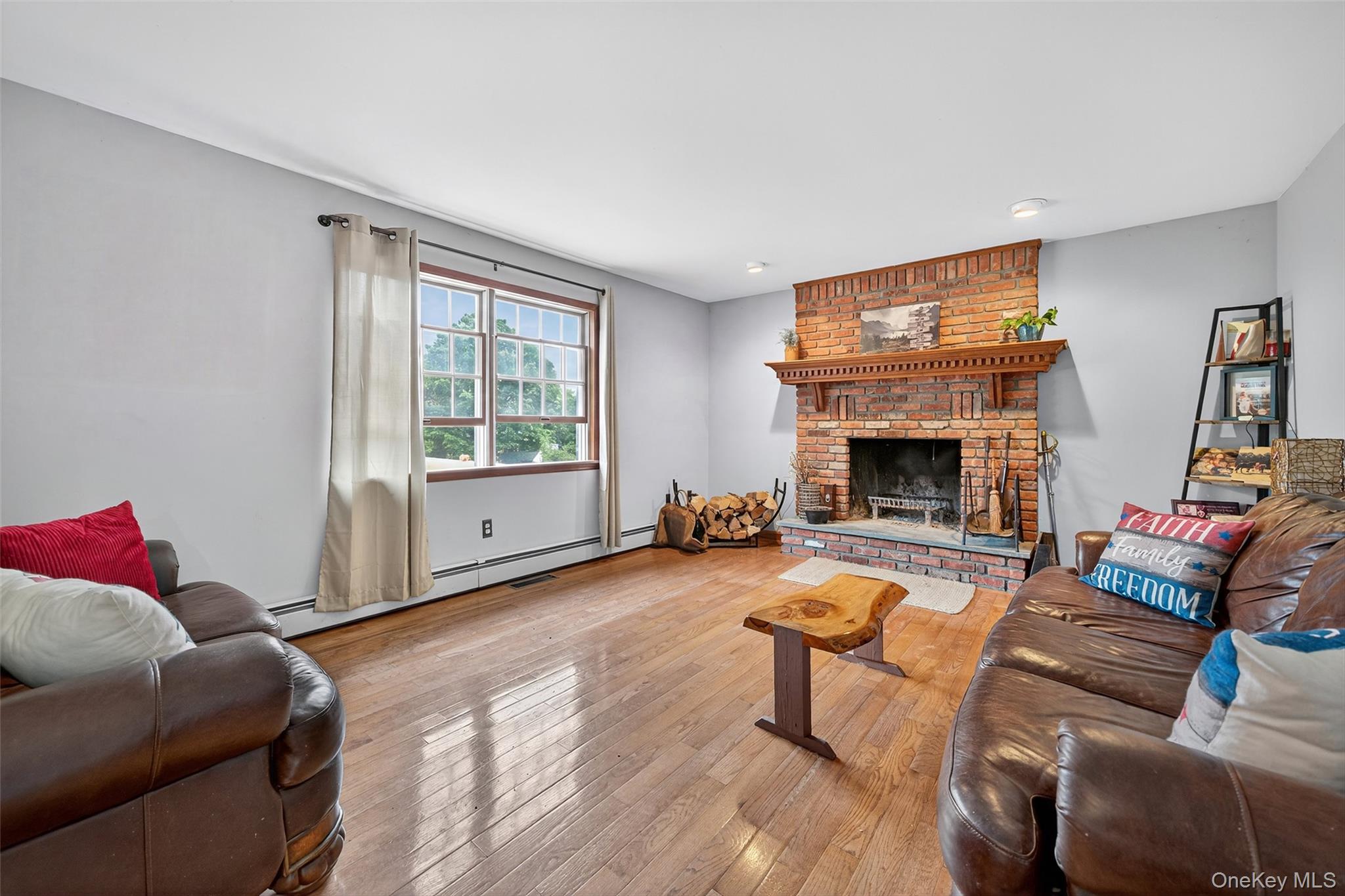 214 Dubois Road Gardiner, NY 12561 - Photo 14 of 38 a living room with furniture and a fireplace
