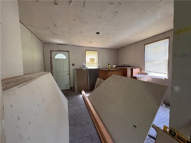 a view of a kitchen with cabinets and wooden floor