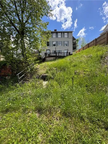 a view of a house with a back yard