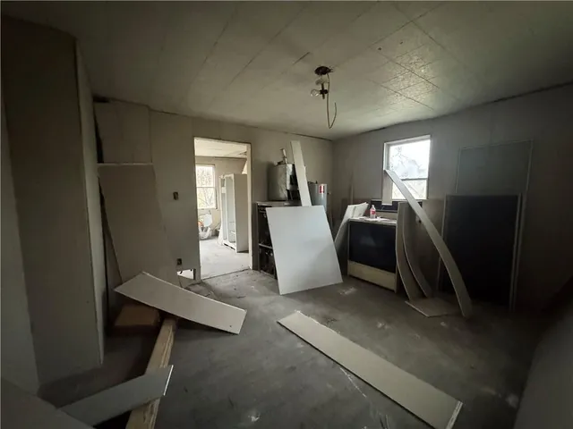 a view of a living room with furniture and a window