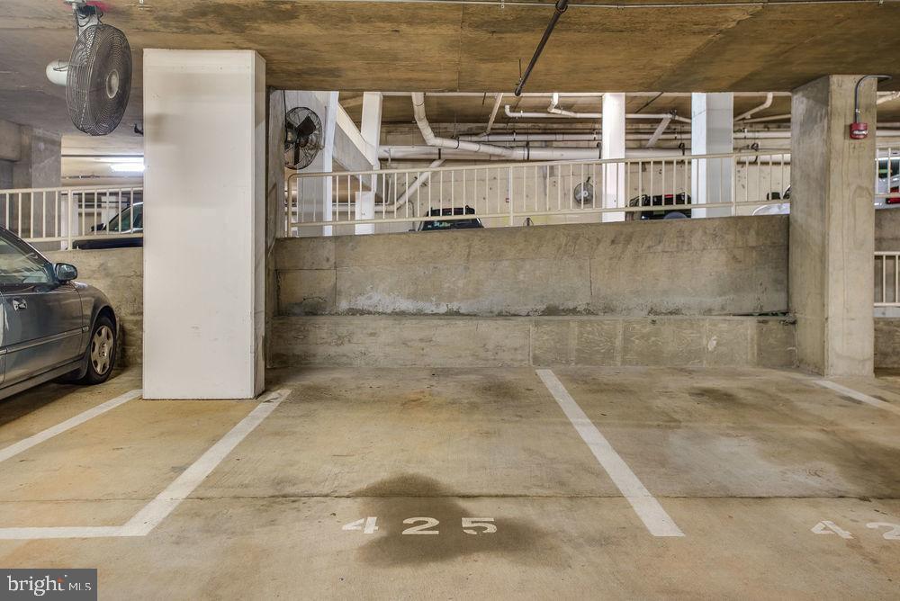 3830 9th Street North, Unit 607E Arlington, VA 22203 - Photo 11 of 17 an empty room with wooden floor and windows