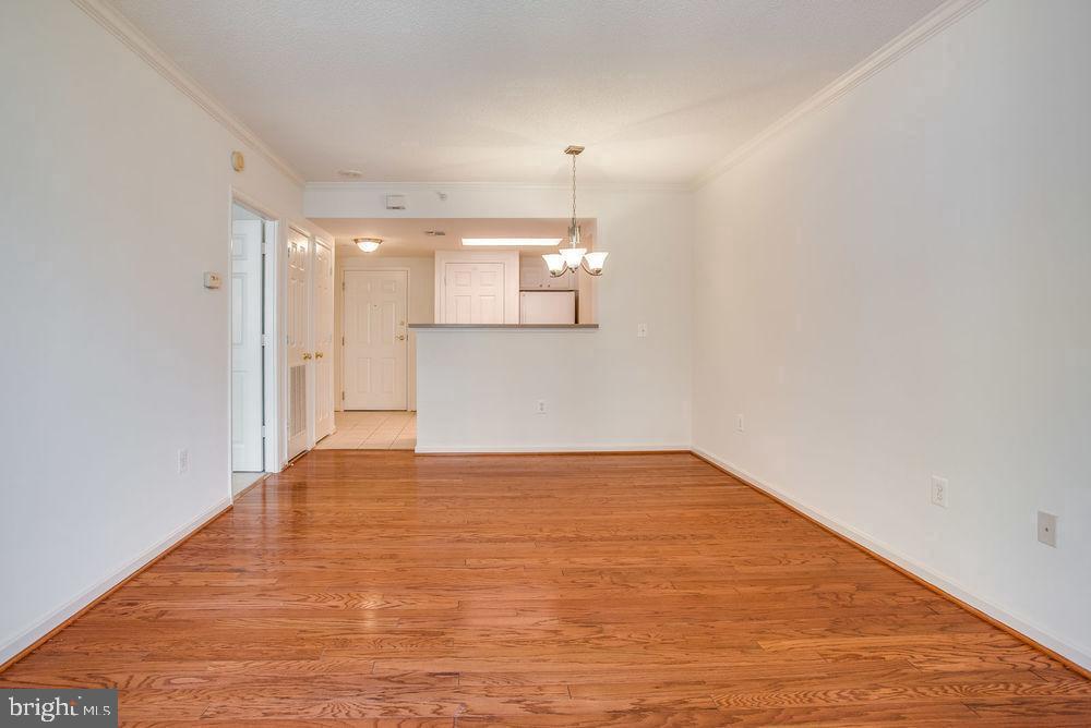 3830 9th Street North, Unit 607E Arlington, VA 22203 - Photo 3 of 17 a view of empty room with wooden floor