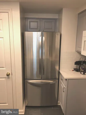 a bathroom with a sink a washer and dryer