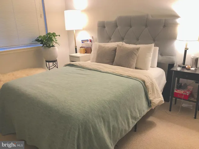 a bathroom with a toilet and a shower curtain
