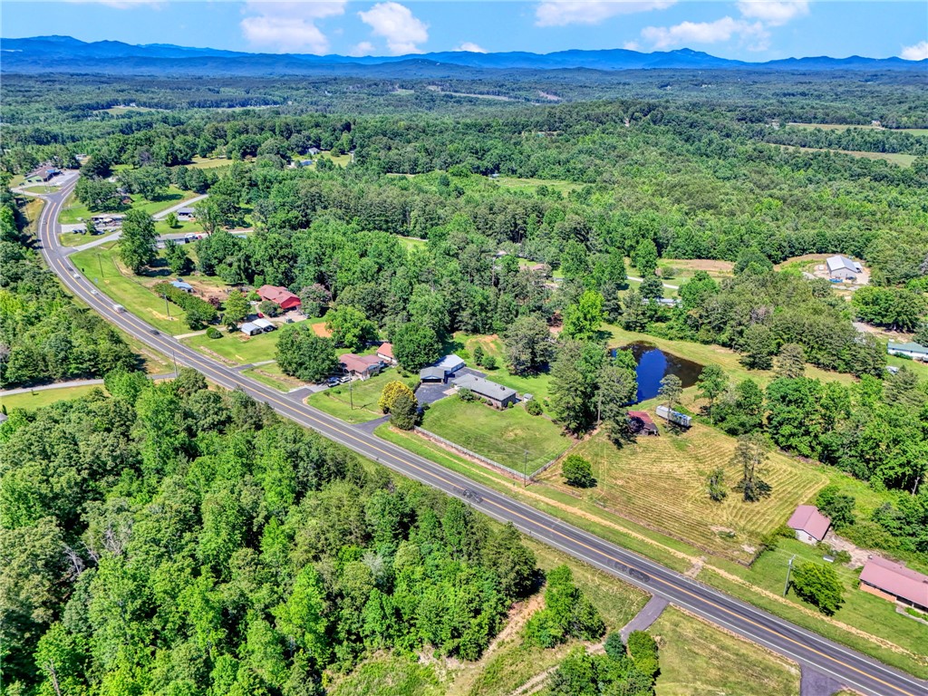 7876 Highway 11 Walhalla, SC 29691 - Photo 33 of 35 Discover a tranquil rural property with a private pond, expansive woods, and peaceful views.