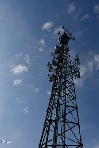 a bathroom with a black and white wall