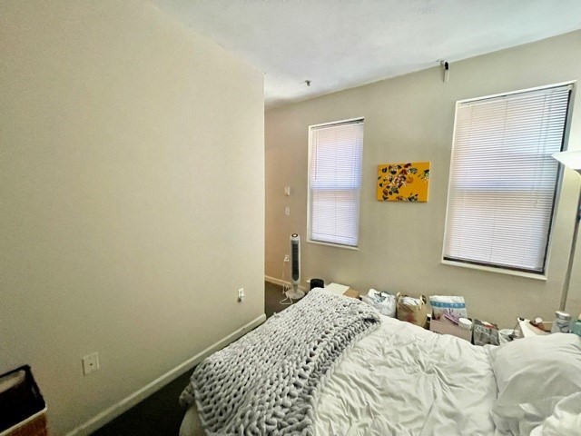 17 Thacher Street, Unit 3 Boston, MA 02113 - Photo 23 of 24 a bedroom with a bed and a window