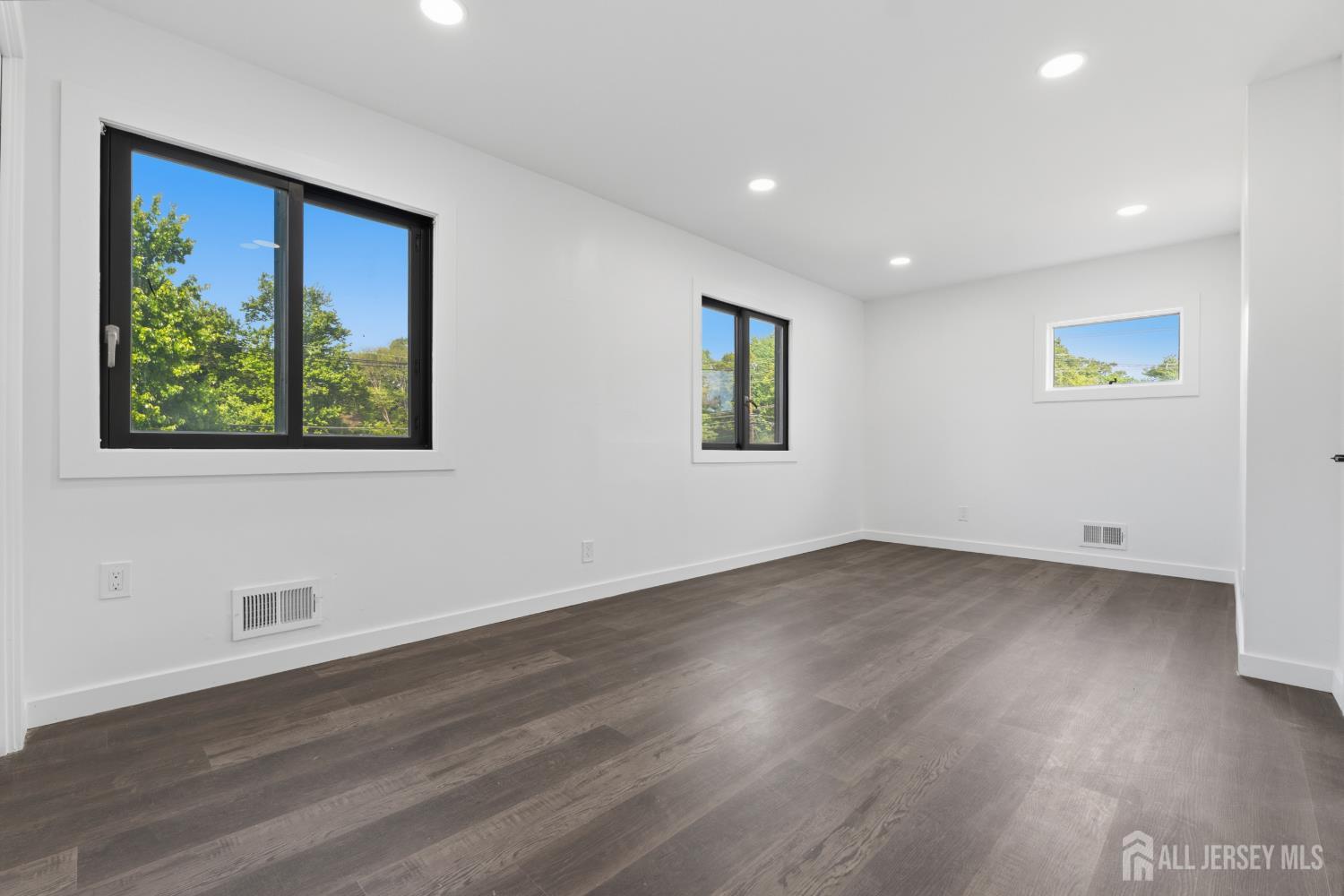 12 Daniel Road Spotswood, NJ 08884 - Photo 16 of 27 a view of a big room with wooden floor and window