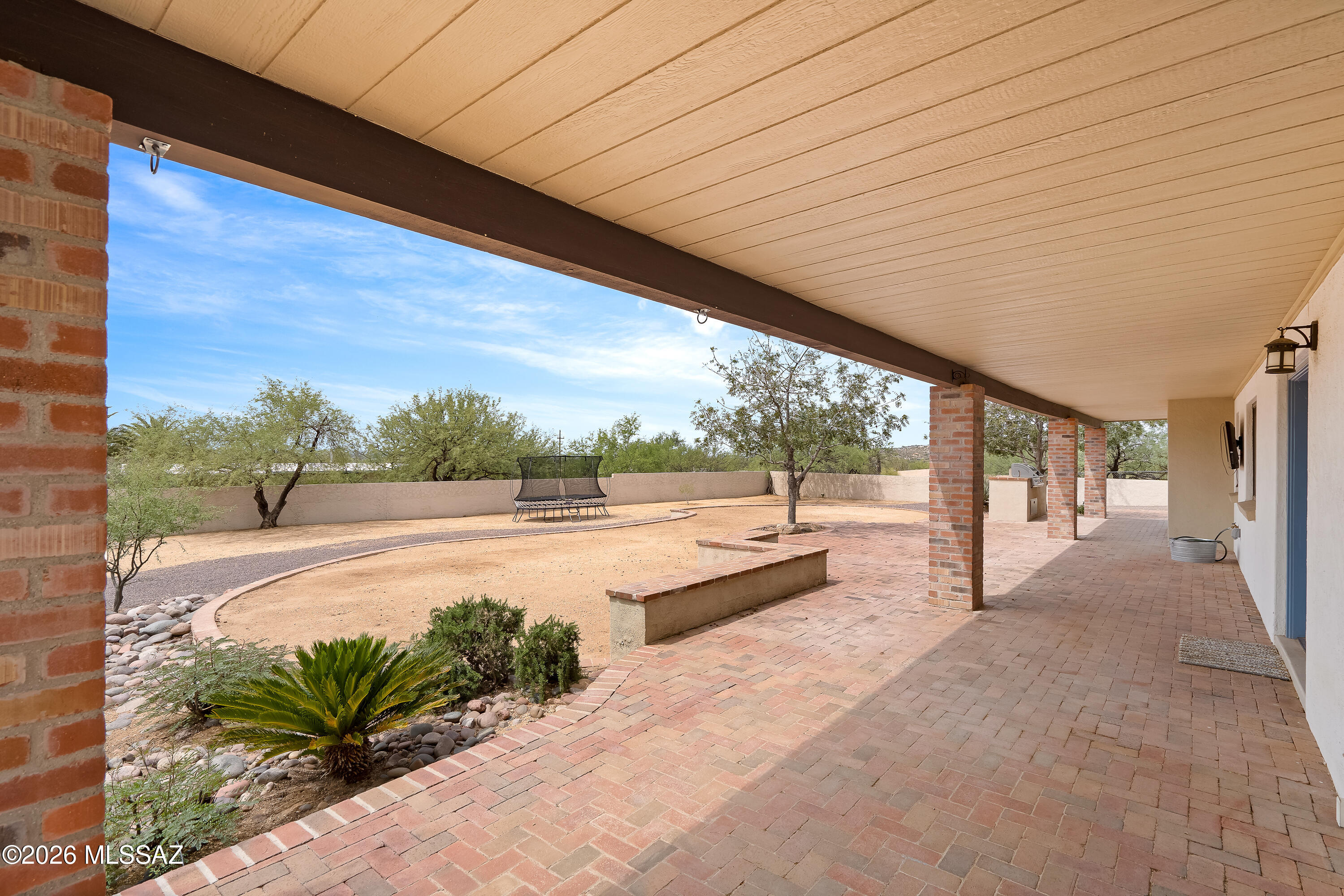 9420 East Ravine Trail Tucson, AZ 85749 - Photo 24 of 39 a view of a swimming pool with a patio