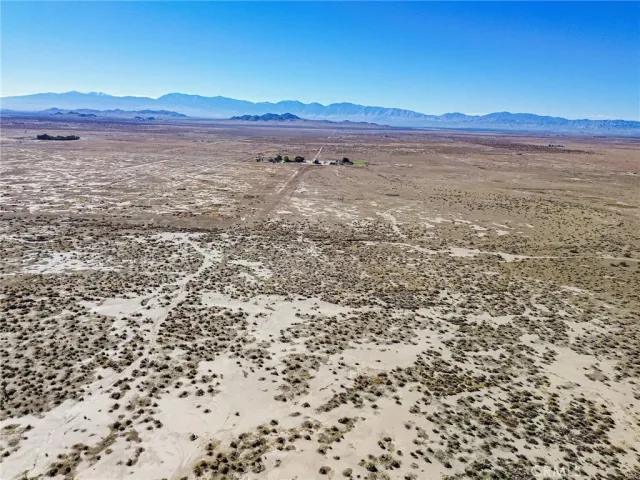 a view of an ocean beach and mountain