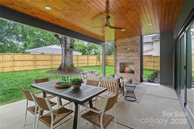 a view of an outdoor dining space with a table and chairs