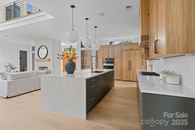 a large kitchen with kitchen island granite countertop lots of counter top space