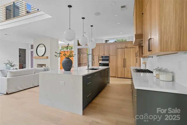 a large kitchen with kitchen island granite countertop lots of counter top space