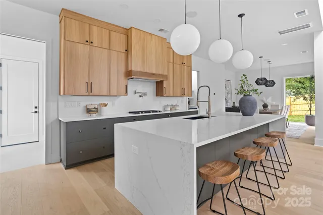 a kitchen with a sink cabinets and window