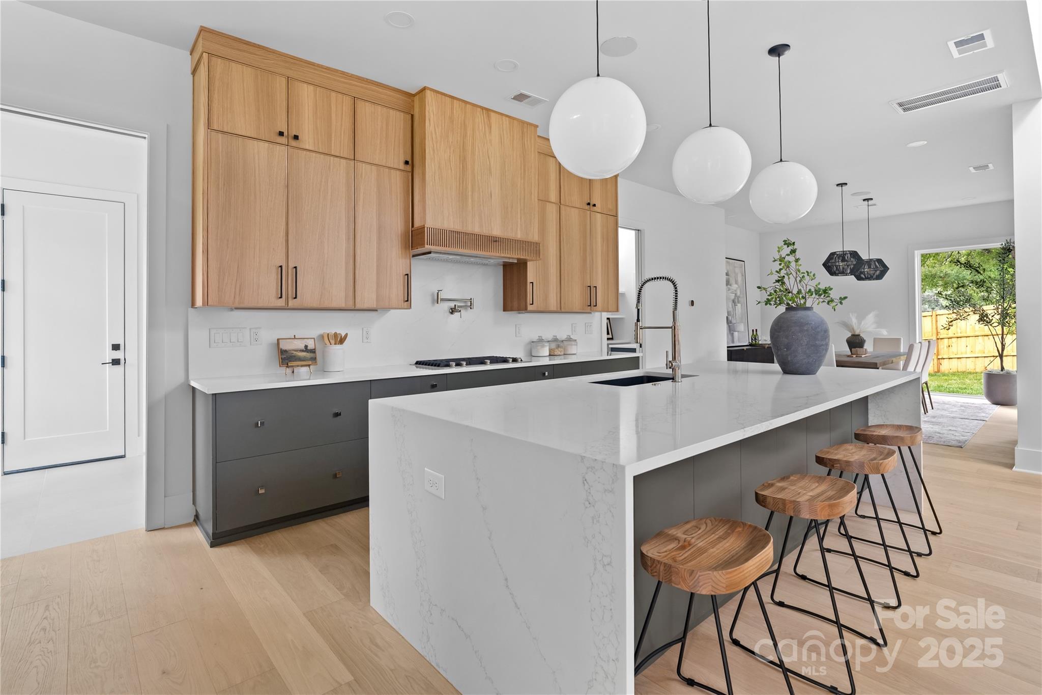3822 Topsfield Road Charlotte, NC 28211 - Photo 19 of 43 a kitchen with a sink cabinets and window