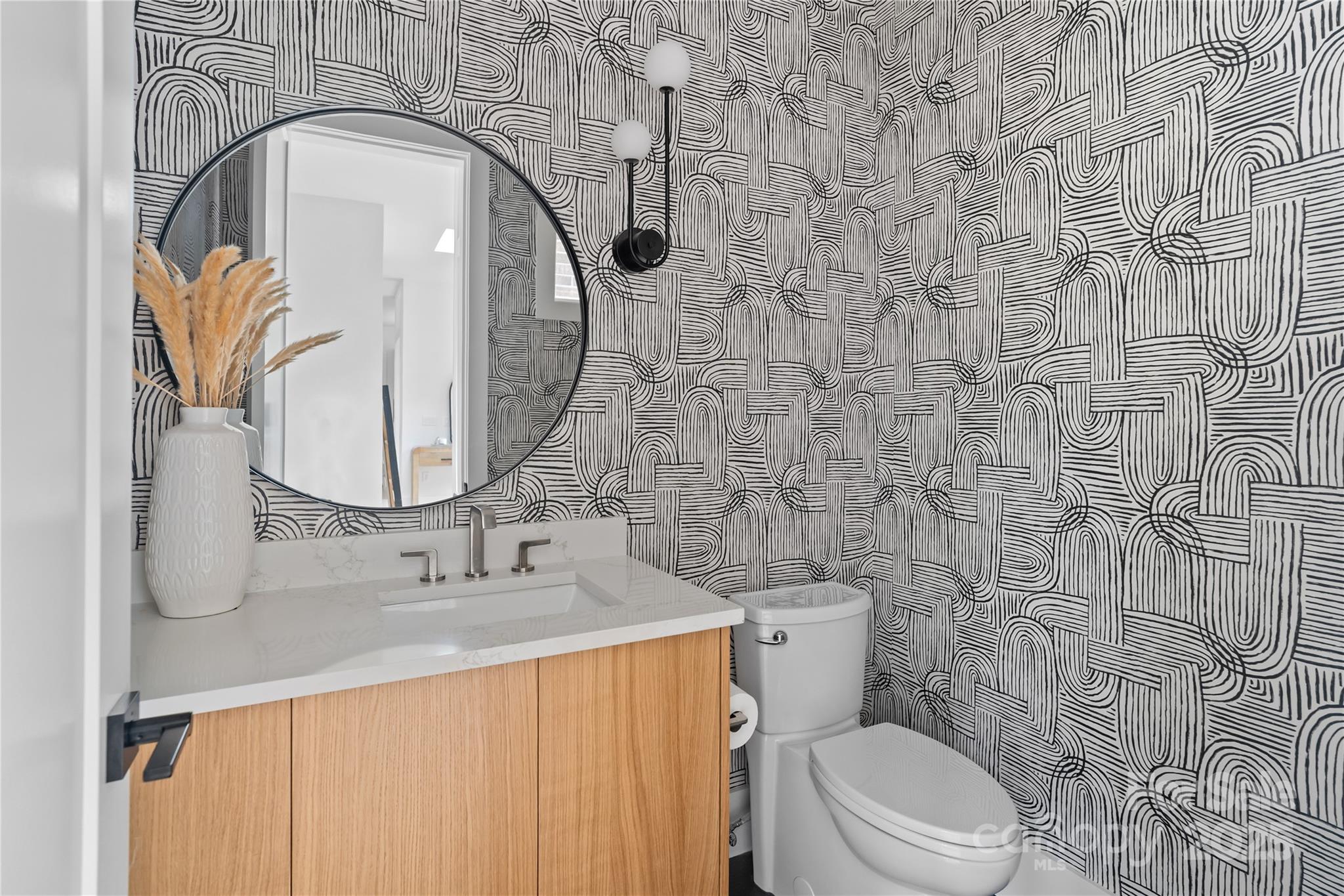 3822 Topsfield Road Charlotte, NC 28211 - Photo 23 of 43 a bathroom with a sink a toilet and a mirror