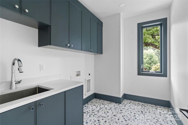 a kitchen with a sink and cabinets