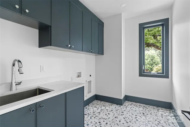 a kitchen with a sink and cabinets