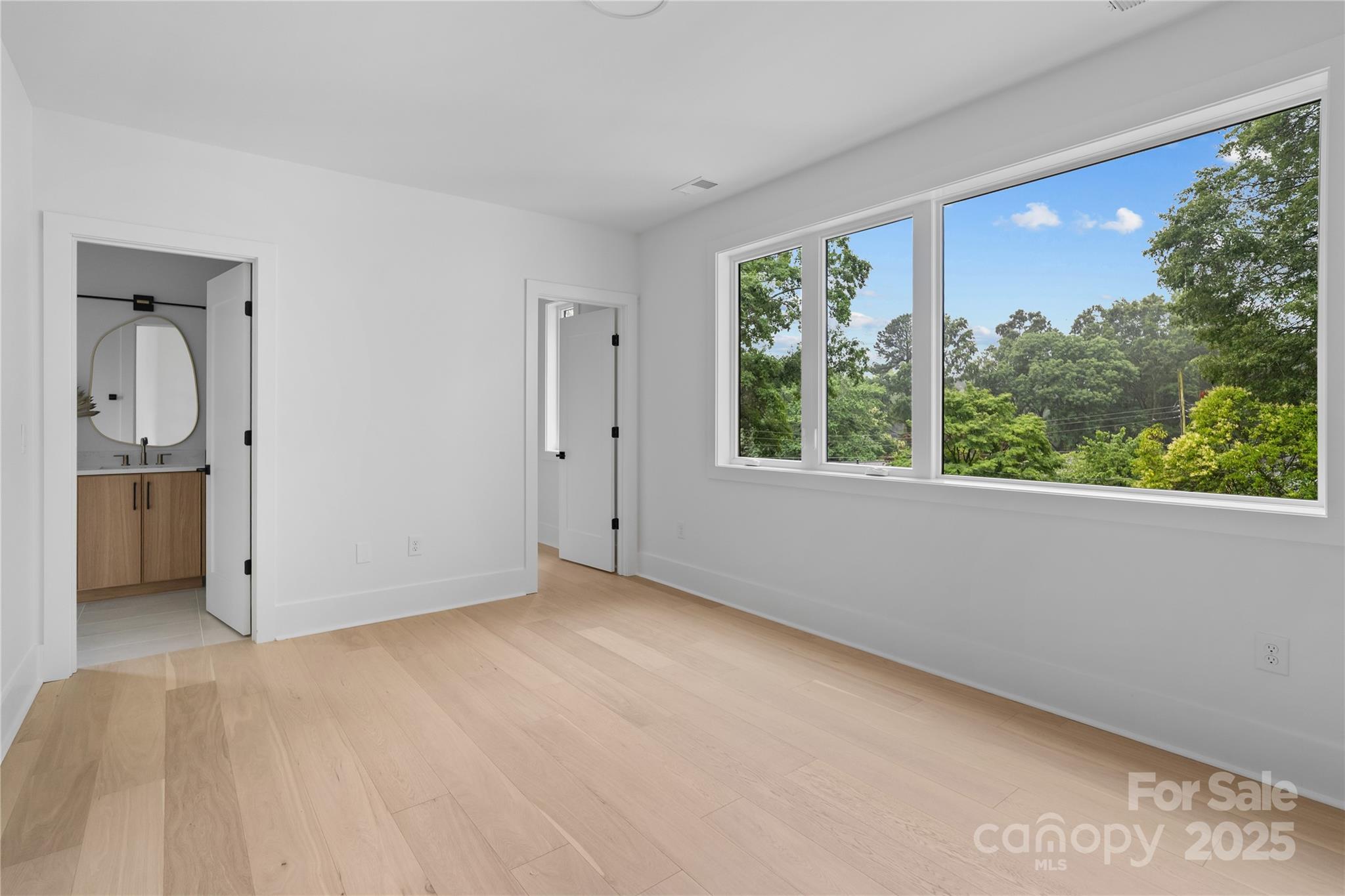 3822 Topsfield Road Charlotte, NC 28211 - Photo 32 of 43 a view of an empty room with a window