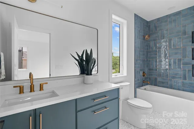 a bathroom with a sink a toilet and a bathtub