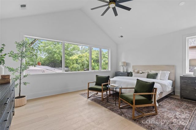 a bedroom with furniture and a window
