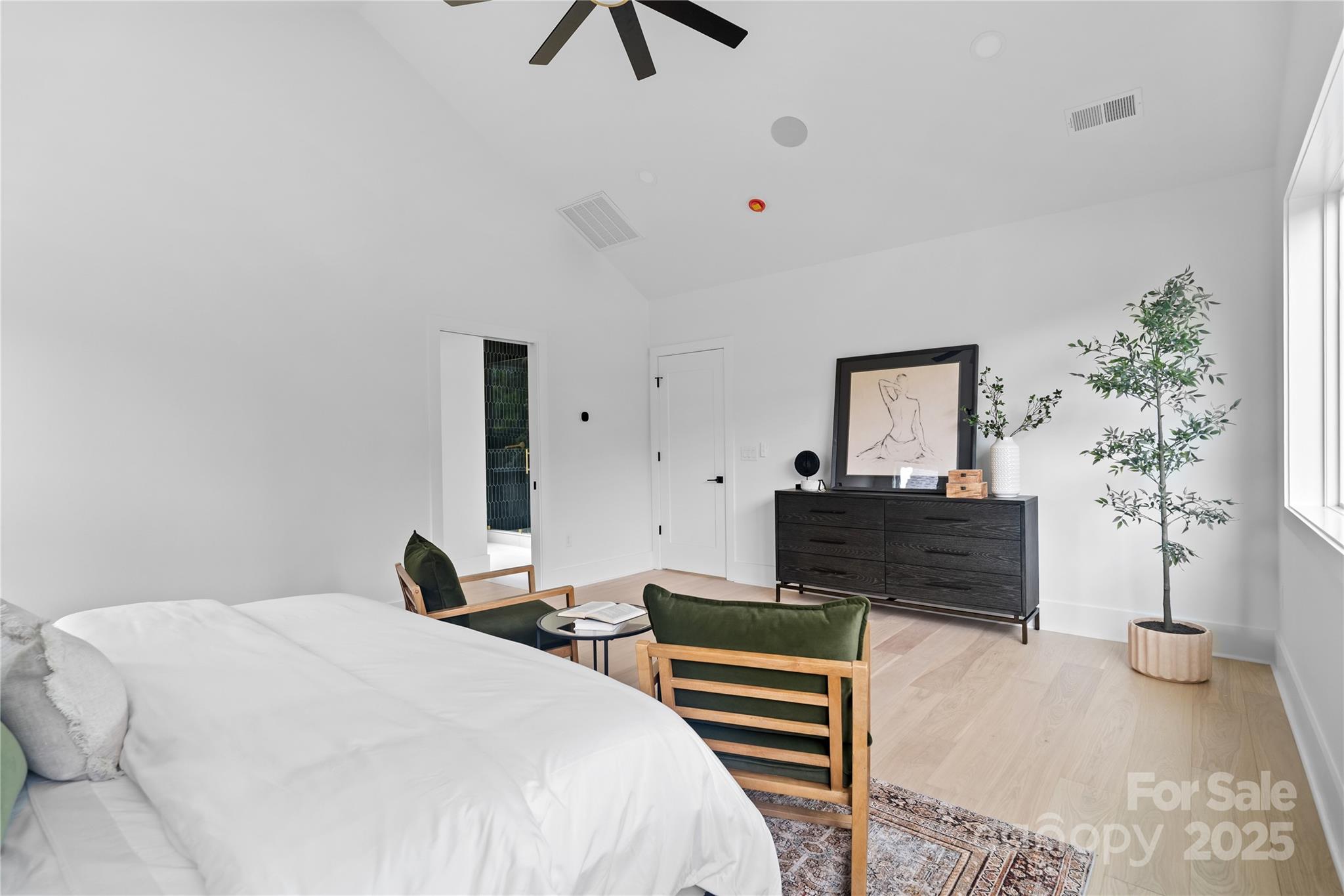 3822 Topsfield Road Charlotte, NC 28211 - Photo 35 of 43 a bedroom with furniture and a potted plant