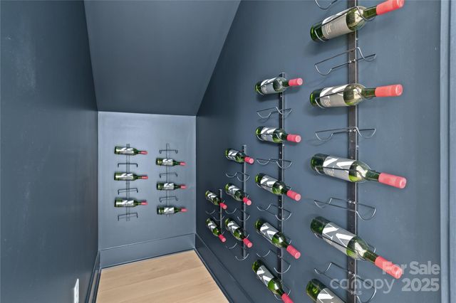 a vase of flowers sitting on a table in a kitchen