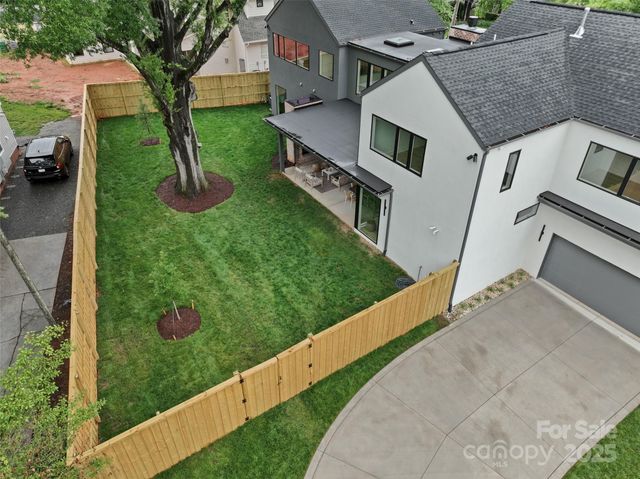 a view of a house with a yard porch and sitting area
