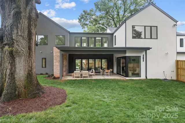 a front view of a house with a yard and porch