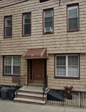 a bathroom with a toilet a sink and a shower