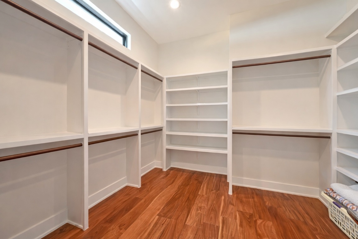 3102 Hunt Trail Austin, TX 78757 - Photo 20 of 38 Walk in closet featuring light wood-style flooring