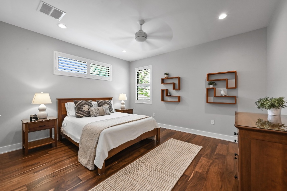 3102 Hunt Trail Austin, TX 78757 - Photo 26 of 38 Bedroom with dark wood-style flooring, a ceiling fan, and recessed lighting