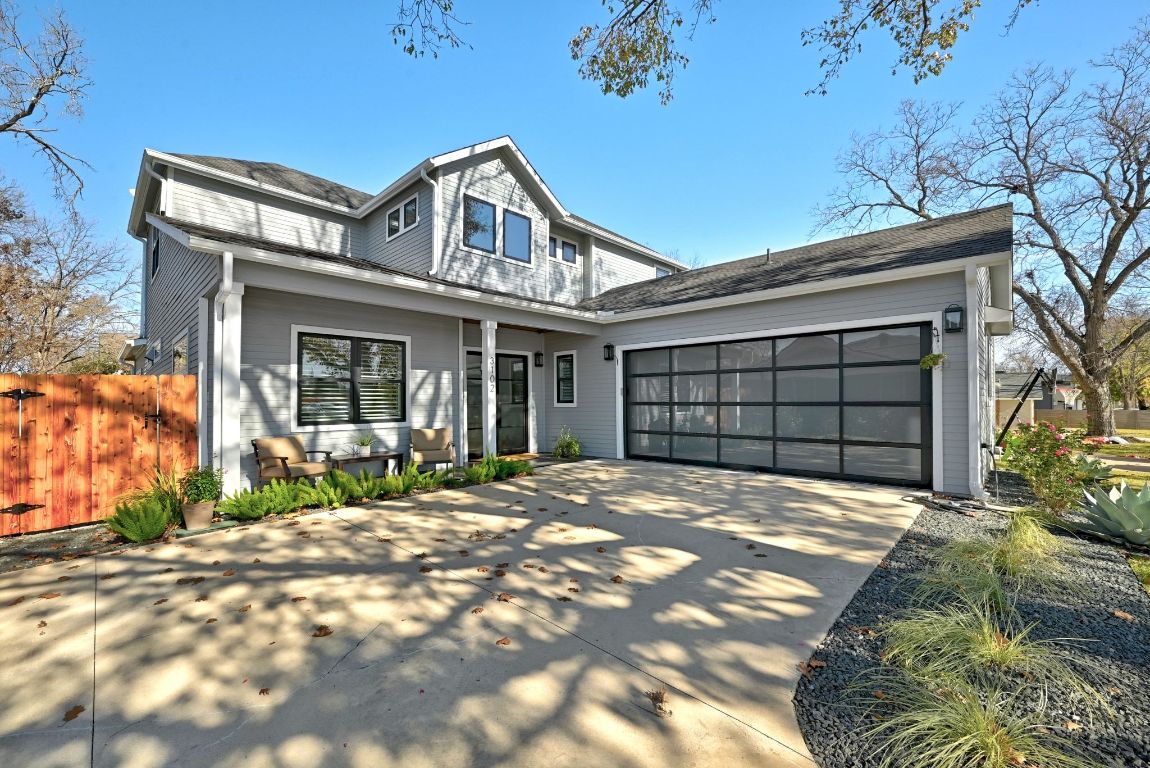 3102 Hunt Trail Austin, TX 78757 - Photo 36 of 38 View of front of home featuring concrete driveway and an attached garage