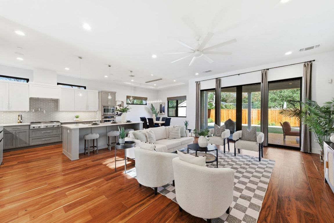 3102 Hunt Trail Austin, TX 78757 - Photo 7 of 38 Living area featuring light wood-style flooring, recessed lighting, and a ceiling fan