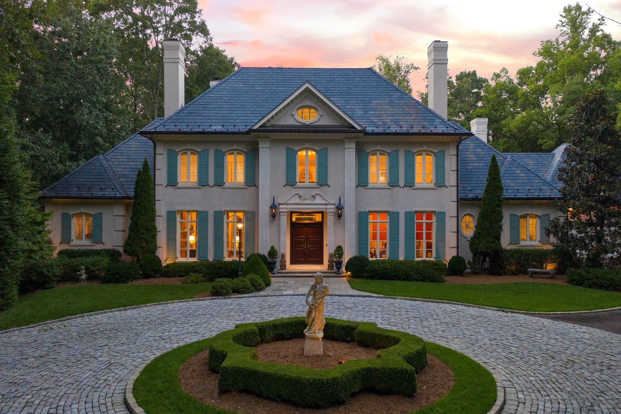 6036 Over Hadden Court Raleigh, NC 27614 - Photo 2 of 30 Beautifully landscaped home with incredible nightscaping, water feature, meticulously landscaping, hardscaping & irrigation. This home was designed to age in place equipped w/ an elevator & wider door opening for wheel chair access. 1st & 2nd Master Suite Exterior Front