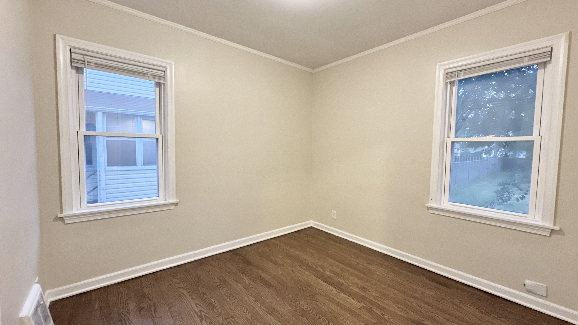 21209 Oak Street Matteson, IL 60443 - Photo 8 of 18 a view of an empty room with wooden floor and a window